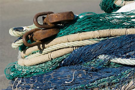 Fishing nets and ropes in a heap, extreme close-up Stock Photo - Premium Royalty-Free, Code: 633-02645556