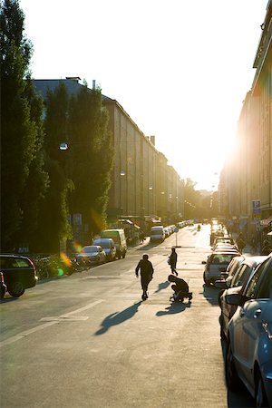 sun rising in city - Sweden, Stockholm, street brightly illuminated at sunset Stock Photo - Premium Royalty-Free, Code: 633-02691318