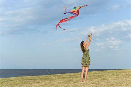 flying kites - Woman flying kite Stock Photo - Premium Royalty-Free, Code: 633-03194725