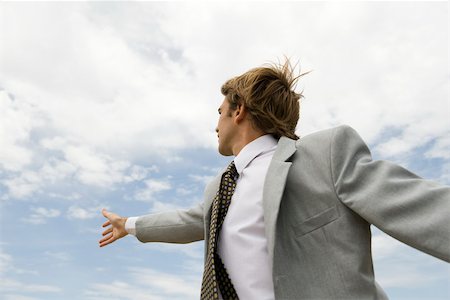 reaching sky - Businessman reaching towards sky Stock Photo - Premium Royalty-Free, Code: 633-03194773