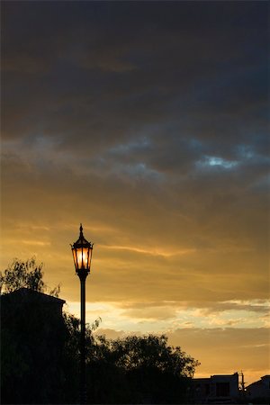 Street lamp illuminated at dusk Stock Photo - Premium Royalty-Free, Code: 633-03444482