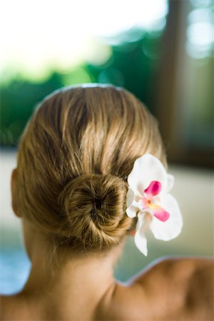 Woman with orchid in hair, rear view Foto de stock - Sin royalties Premium, Código: 633-03444529