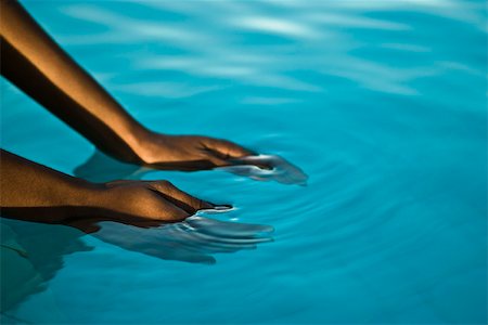 female underwater still - Hands in blue water Stock Photo - Premium Royalty-Free, Code: 633-03444535