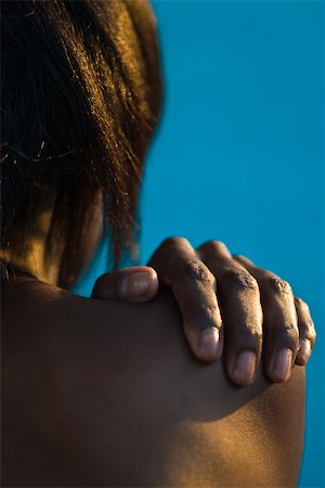 parts of human body female - Woman's hand on bare shoulder Stock Photo - Premium Royalty-Free, Code: 633-03444540