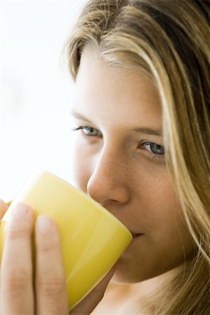 simsearch:632-03847818,k - Young woman enjoying cup of coffee, portrait Stock Photo - Premium Royalty-Free, Code: 633-03444598