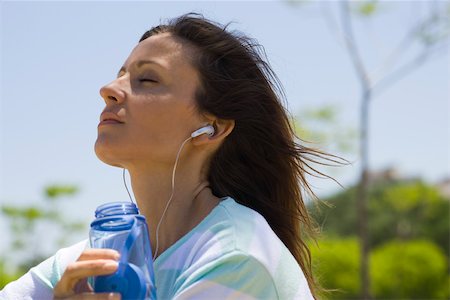 fresh air - Woman listening to earphones outdoors Stock Photo - Premium Royalty-Free, Code: 633-03444664