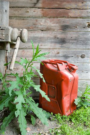 Gas can on ground outdoors Stock Photo - Premium Royalty-Free, Code: 633-03444784