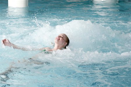 Young woman swimming in spa pool Stock Photo - Premium Royalty-Free, Code: 644-01435734