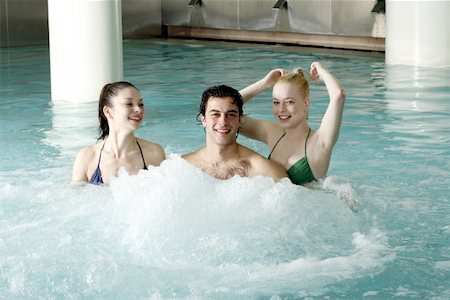 Young people swimming in spa pool Stock Photo - Premium Royalty-Free, Code: 644-01435737