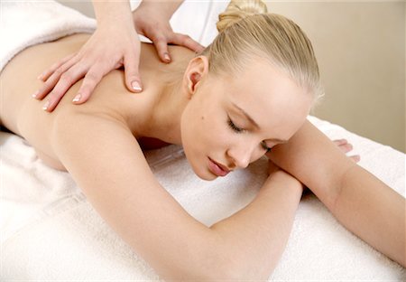 simsearch:644-01435745,k - Young woman enjoying a massage Fotografie stock - Premium Royalty-Free, Codice: 644-01435744