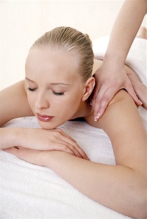 simsearch:644-01435745,k - Young woman enjoying a massage Fotografie stock - Premium Royalty-Free, Codice: 644-01435743