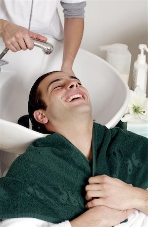 double sink - Young man having his hair  washed at a salon Stock Photo - Premium Royalty-Free, Code: 644-01435806