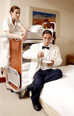 simsearch:644-01435898,k - Hotel maid and waiter taking a break Stock Photo - Premium Royalty-Free, Code: 644-01435895