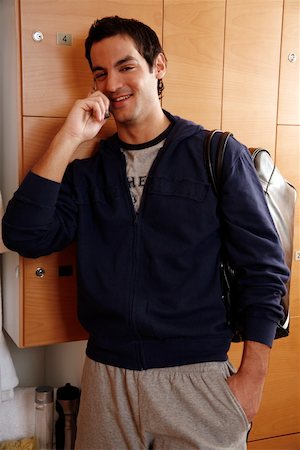 spanish male dress - Man in locker room after work out talking on cell phone Foto de stock - Sin royalties Premium, Código: 644-01436055