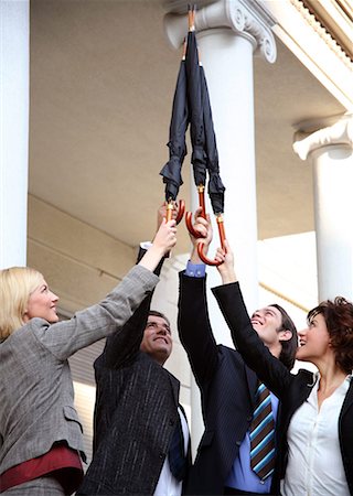 Business people reaching for the sky Stock Photo - Premium Royalty-Free, Code: 644-01436075