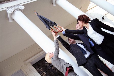 Business people reaching for the sky Stock Photo - Premium Royalty-Free, Code: 644-01436085