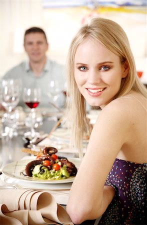 photography mediterranean dining room - Young woman dining in a restaurant Stock Photo - Premium Royalty-Free, Code: 644-01436208