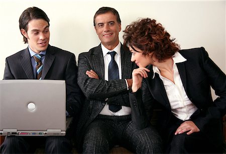 sexually excited man at office - Three people sitting in a waiting room Stock Photo - Premium Royalty-Free, Code: 644-01436210