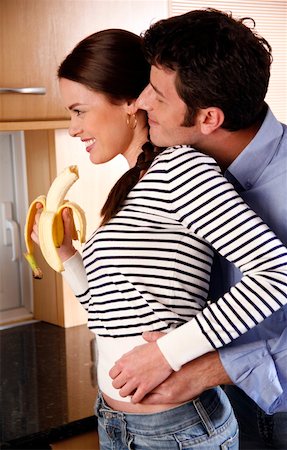 emotional disturbance males - A young couple in the kitchen Stock Photo - Premium Royalty-Free, Code: 644-01436343
