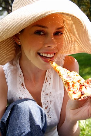 european rimming closeup - Young woman eating pizza Stock Photo - Premium Royalty-Free, Code: 644-01436365