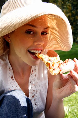 european rimming closeup - Young woman eating pizza Stock Photo - Premium Royalty-Free, Code: 644-01436366