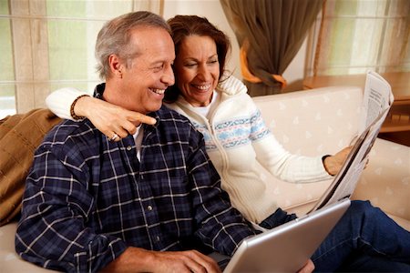 Mature couple relaxing at home Stock Photo - Premium Royalty-Free, Code: 644-01436417