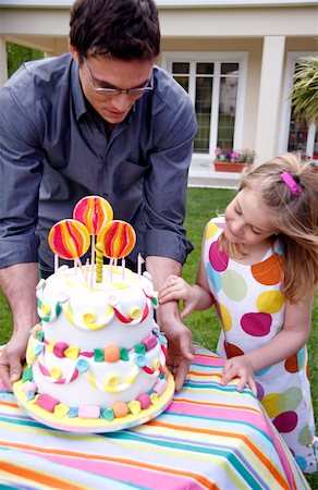 Man holding party cake Stock Photo - Premium Royalty-Free, Code: 644-01436445