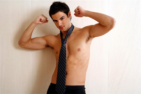 seduction tie - Bare chested young man posing with shorts and tie Stock Photo - Premium Royalty-Free, Code: 644-01436533