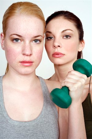simsearch:644-01436045,k - Two young women with dumbbell Stock Photo - Premium Royalty-Free, Code: 644-01436546
