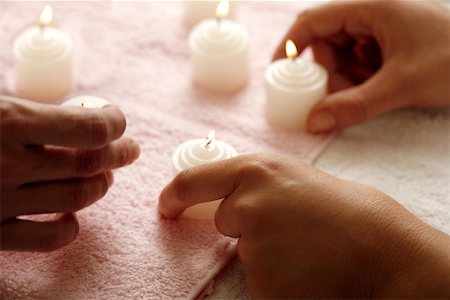 Hands with lit candles Stock Photo - Premium Royalty-Free, Code: 644-01436757