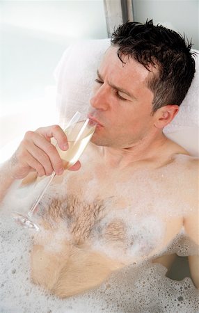 Man relaxing in bathtub with bubbles Stock Photo - Premium Royalty-Free, Code: 644-01436774