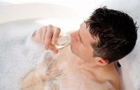 Man relaxing in bathtub with bubbles Stock Photo - Premium Royalty-Free, Code: 644-01436775