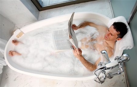 Man relaxing in bathtub with bubbles Stock Photo - Premium Royalty-Free, Code: 644-01436770
