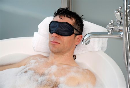 Man relaxing in bathtub with bubbles Stock Photo - Premium Royalty-Free, Code: 644-01436773