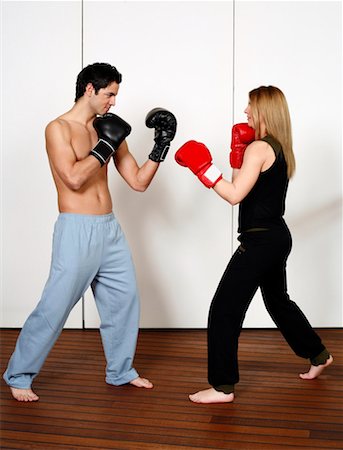 dancing couple young women blond hair - Straight right-hand punch of Active Tae Bo and inside block Stock Photo - Premium Royalty-Free, Code: 644-01436935