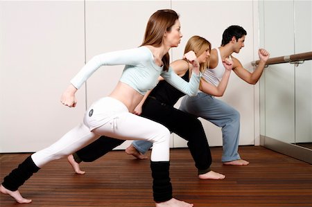 dance teacher - Students learning a basic Capoeira move Stock Photo - Premium Royalty-Free, Code: 644-01436948