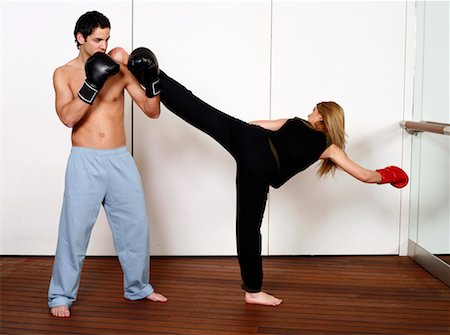 punching black people - Straight right-hand punch of Active Tae Bo and side kick Stock Photo - Premium Royalty-Free, Code: 644-01436940