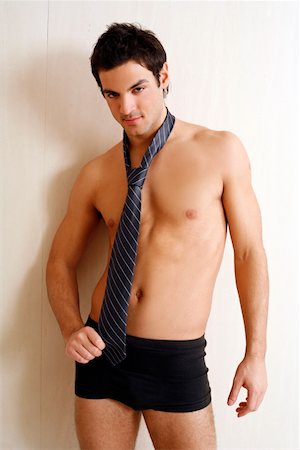 seduction tie - Bare chested young man posing with shorts and tie Stock Photo - Premium Royalty-Free, Code: 644-01436975