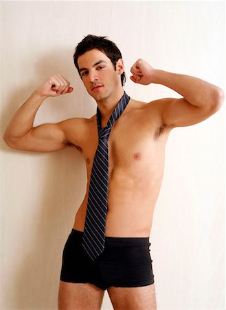 seduction tie - Bare chested young man posing with shorts and tie Stock Photo - Premium Royalty-Free, Code: 644-01436976