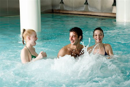 spa with female friend - Young people swimming in spa pool Stock Photo - Premium Royalty-Free, Code: 644-01436994