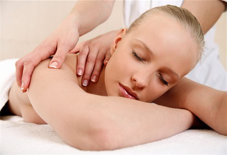 Young woman enjoying a massage Stock Photo - Premium Royalty-Free, Code: 644-01437108
