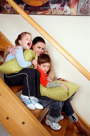 Mother with tired children on staircase Stock Photo - Premium Royalty-Free, Code: 644-01437254