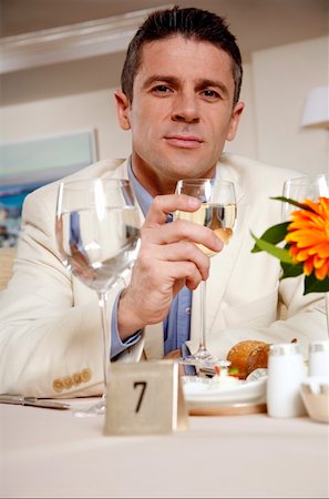 Man sitting in at the table in a restaurant Stock Photo - Premium Royalty-Free, Code: 644-01437307