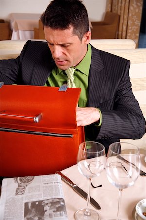 Man sitting at the table in a restaurant Stock Photo - Premium Royalty-Free, Code: 644-01437315