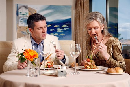 shocked eating - Mature couple dining in a restaurant Stock Photo - Premium Royalty-Free, Code: 644-01437311