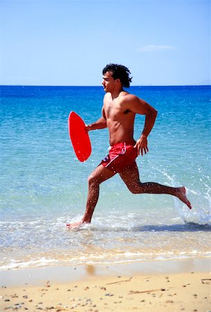 simsearch:644-01437823,k - Man running on beach Foto de stock - Royalty Free Premium, Número: 644-01437483