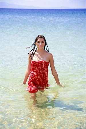 red scarf woman - Young woman wading through water Stock Photo - Premium Royalty-Free, Code: 644-01437502