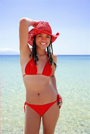 simsearch:644-01437512,k - Young woman in bikini and hat on the beach Foto de stock - Sin royalties Premium, Código: 644-01437527