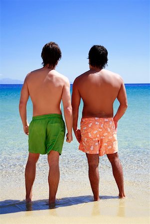 european man gay pic - Two men on the beach looking out to sea Stock Photo - Premium Royalty-Free, Code: 644-01437565