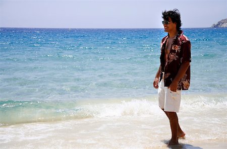 Man walking on the beach Stock Photo - Premium Royalty-Free, Code: 644-01437619